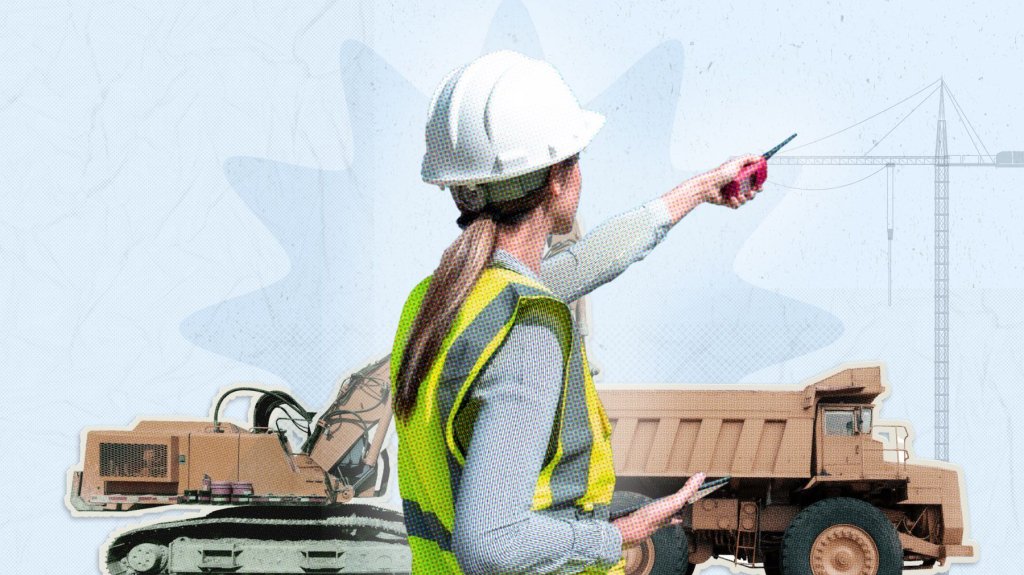 Woman in hard hat pointing at construction equipment.